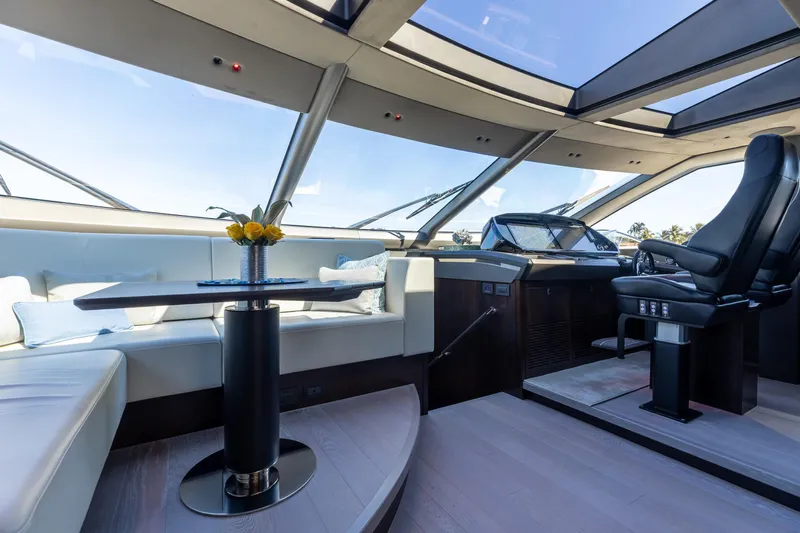 White Star Yacht Photos Pics Luxurious interior of 2023 Sunseeker 90 Ocean yacht with panoramic windows and elegant seating.