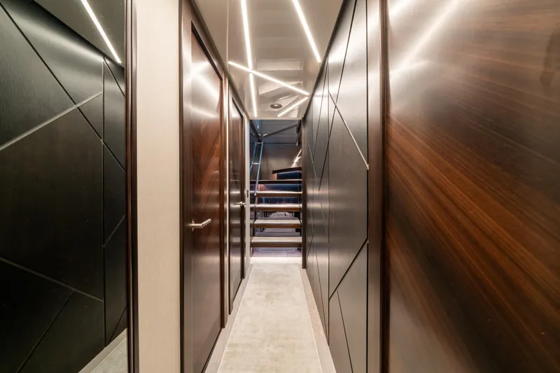 White Star Yacht Photos Pics Luxurious interior hallway of 2023 Sunseeker 90 Ocean yacht with modern lighting.