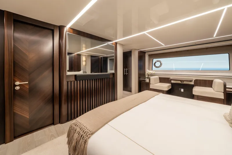 White Star Yacht Photos Pics Luxurious interior of 2023 Sunseeker 90 Ocean yacht with elegant wood finishes and modern design.