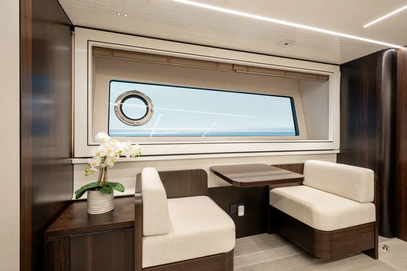 White Star Yacht Photos Pics Luxurious interior of 2023 Sunseeker 90 Ocean yacht with elegant seating and ocean view.