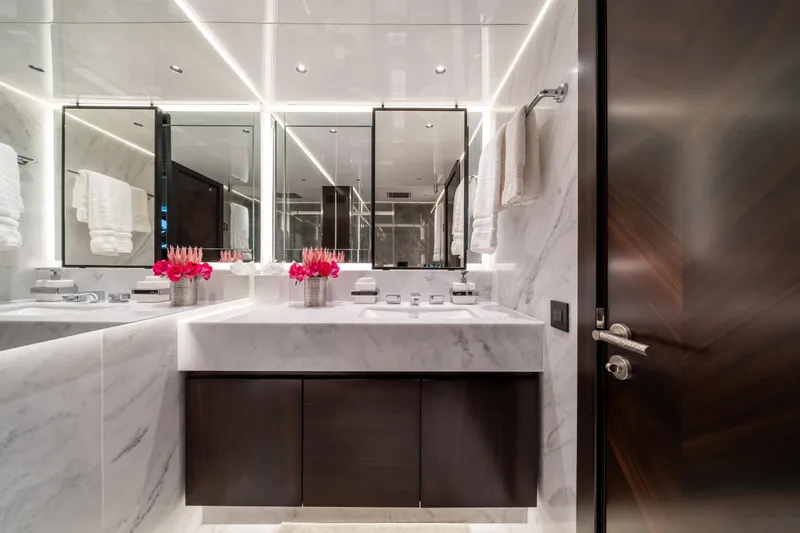 White Star Yacht Photos Pics Luxurious bathroom on 2023 Sunseeker 90 Ocean yacht with marble finishes and elegant decor.