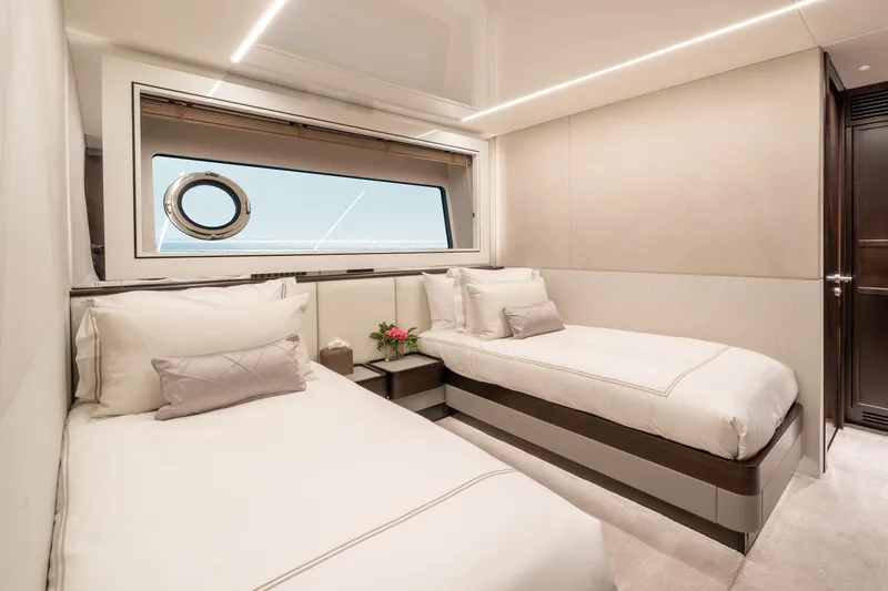 White Star Yacht Photos Pics Luxurious twin cabin interior on 2023 Sunseeker 90 Ocean yacht, featuring elegant bedding and ocean view.