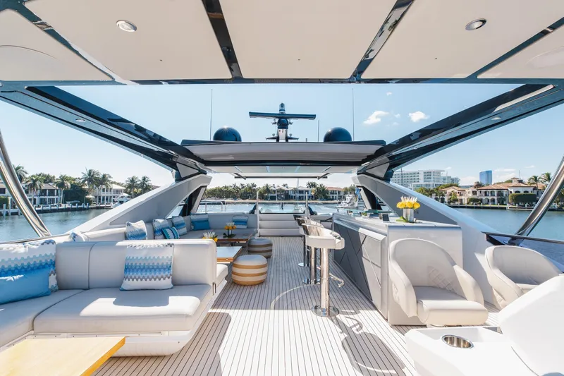 White Star Yacht Photos Pics Luxurious 2023 Sunseeker 90 Ocean yacht interior with elegant seating and scenic waterfront view.