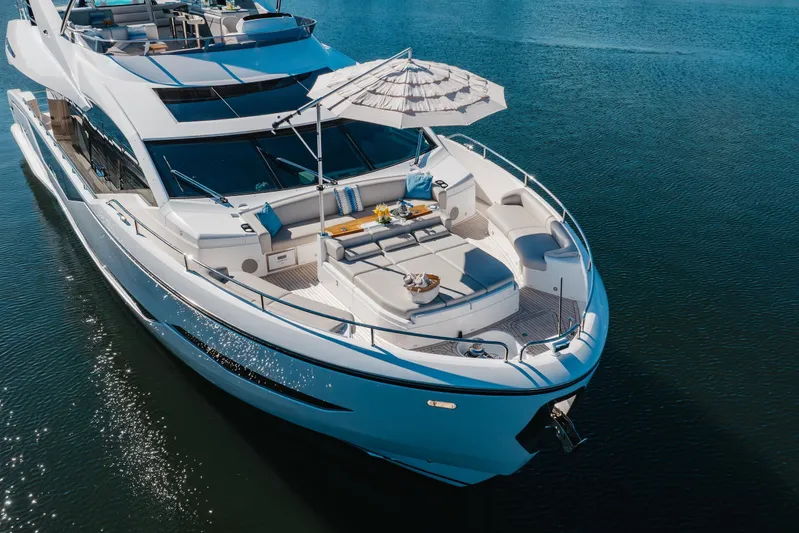 White Star Yacht Photos Pics Luxurious 2023 Sunseeker 90 Ocean yacht with elegant deck and seating area.