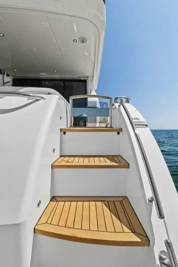 Princess Rose Too Yacht Photos Pics 2016 Princess 60 Flybridge yacht with wooden steps and ocean view.