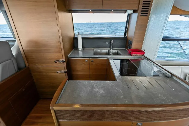 Princess Rose Too Yacht Photos Pics Modern kitchen on 2016 Princess 60 Flybridge yacht with ocean view.