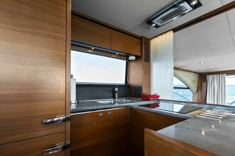 Princess Rose Too Yacht Photos Pics Luxurious kitchen interior of 2016 Princess 60 Flybridge yacht with ocean view.