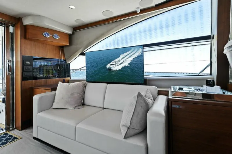 Princess Rose Too Yacht Photos Pics Luxurious 2016 Princess 60 Flybridge yacht interior with modern sofa and large window view.