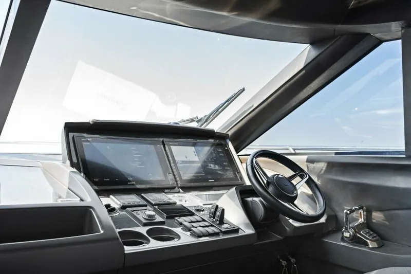 Princess Rose Too Yacht Photos Pics Helm of 2016 Princess 60 Flybridge yacht with modern controls and navigation screens.