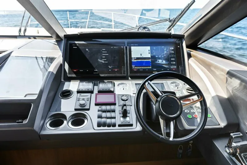 Princess Rose Too Yacht Photos Pics Helm of 2016 Princess 60 Flybridge yacht with modern navigation controls.