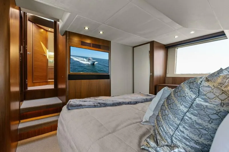 Princess Rose Too Yacht Photos Pics Luxurious 2016 Princess 60 Flybridge yacht bedroom with elegant decor and large window view.
