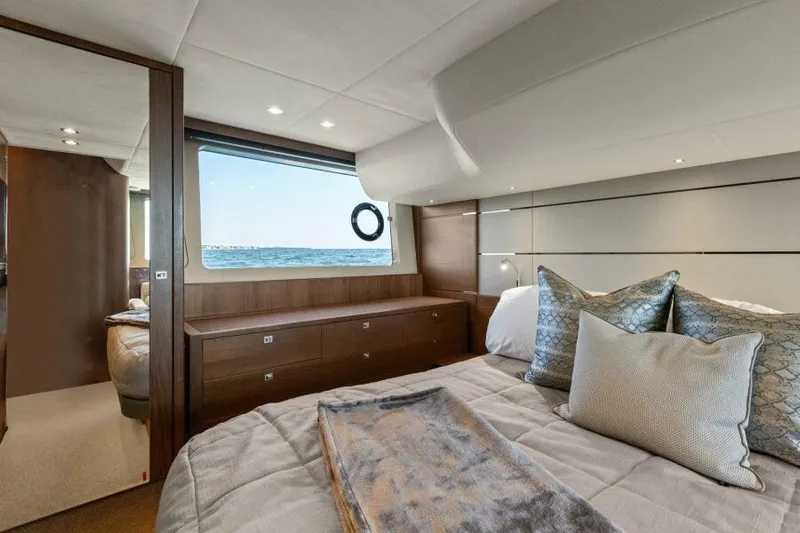 Princess Rose Too Yacht Photos Pics Luxurious bedroom interior of 2016 Princess 60 Flybridge yacht with ocean view.