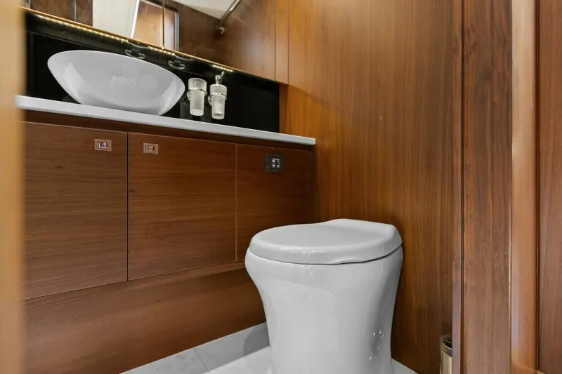 Princess Rose Too Yacht Photos Pics Luxurious bathroom on 2016 Princess 60 Flybridge yacht with modern fixtures.