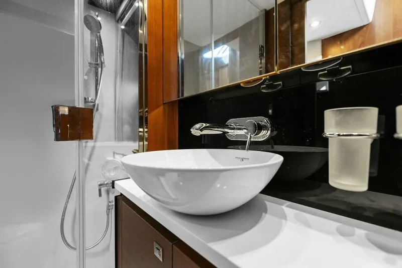 Princess Rose Too Yacht Photos Pics Luxurious bathroom in 2016 Princess 60 Flybridge yacht with modern sink and shower.