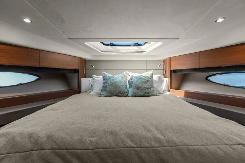 Princess Rose Too Yacht Photos Pics Luxurious bedroom interior of 2016 Princess 60 Flybridge yacht with skylight and elegant bedding.