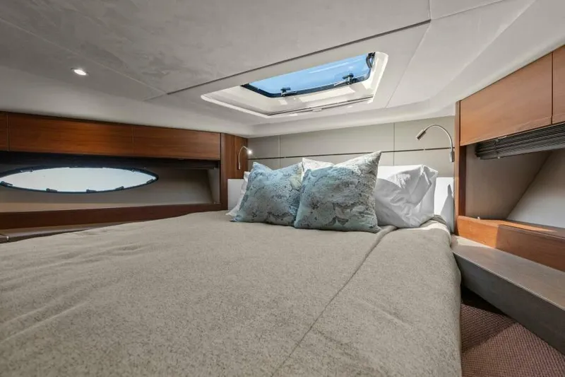 Princess Rose Too Yacht Photos Pics Luxurious bedroom interior of 2016 Princess 60 Flybridge yacht with skylight and elegant bedding.