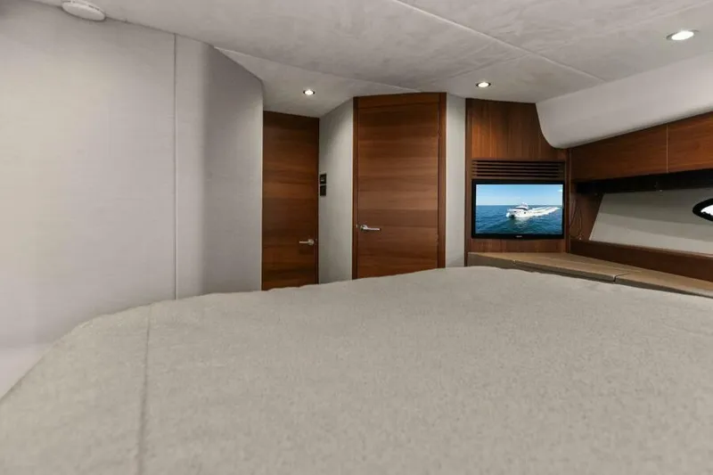 Princess Rose Too Yacht Photos Pics Luxurious cabin interior of 2016 Princess 60 Flybridge yacht with modern wood finishes.