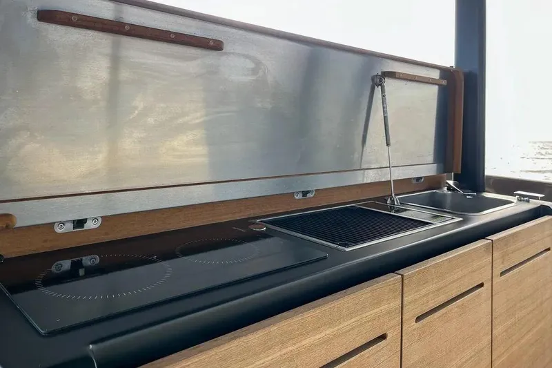  Yacht Photos Pics Modern kitchen area on 2021 Cranchi A46 Luxury Tender yacht, featuring sleek design and appliances.