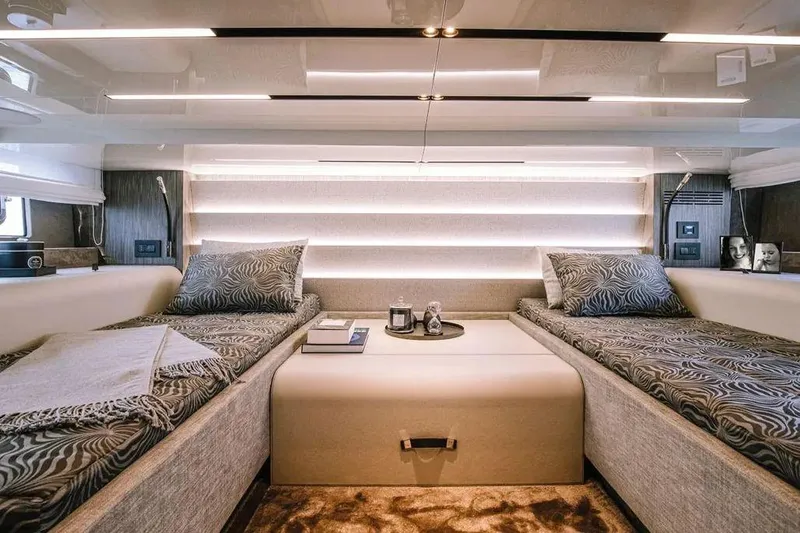  Yacht Photos Pics Luxurious interior of 2021 Cranchi A46 Luxury Tender with twin beds and modern decor.