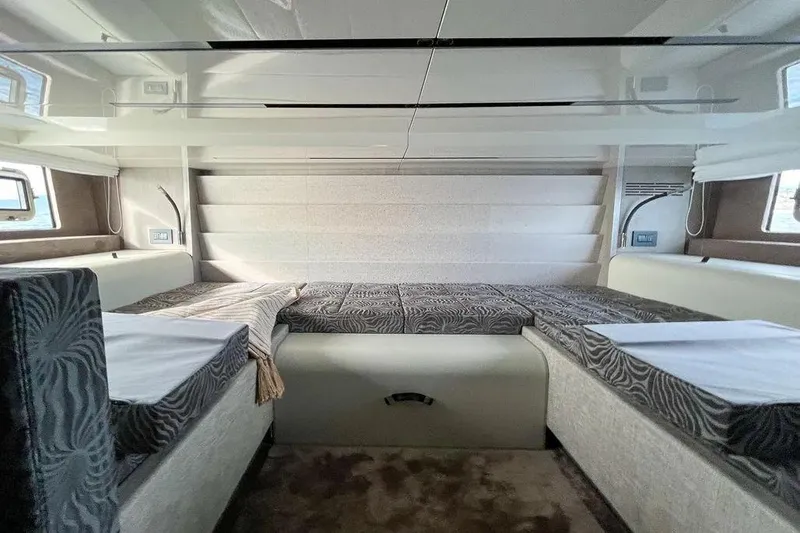  Yacht Photos Pics Interior of 2021 Cranchi A46 Luxury Tender with modern bedding and sleek design.