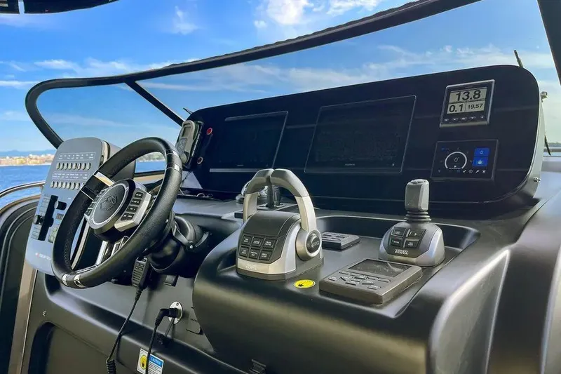  Yacht Photos Pics Cockpit of 2021 Cranchi A46 Luxury Tender with modern controls and steering wheel.