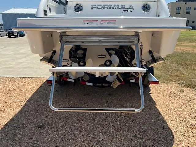  Yacht Photos Pics 2025 Formula 310 Bowrider I/O boat rear view with propellers and swim platform.