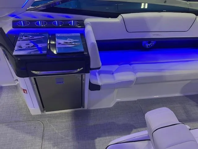  Yacht Photos Pics 2025 Formula 310 Bowrider I/O interior with blue LED lighting and luxurious seating.