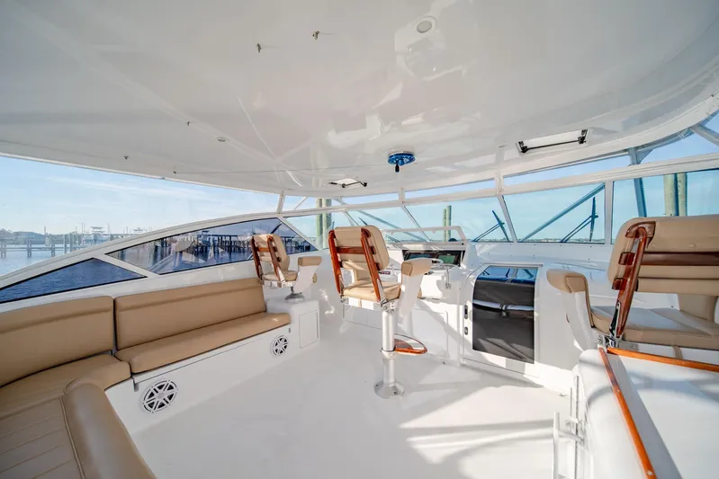 Urgent Sea Yacht Photos Pics Spacious interior of 2003 Viking 45 Express yacht with seating and helm.