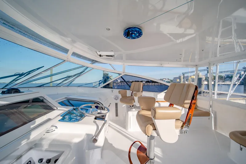 Urgent Sea Yacht Photos Pics Luxurious 2003 Viking 45 Express yacht interior with helm and seating.