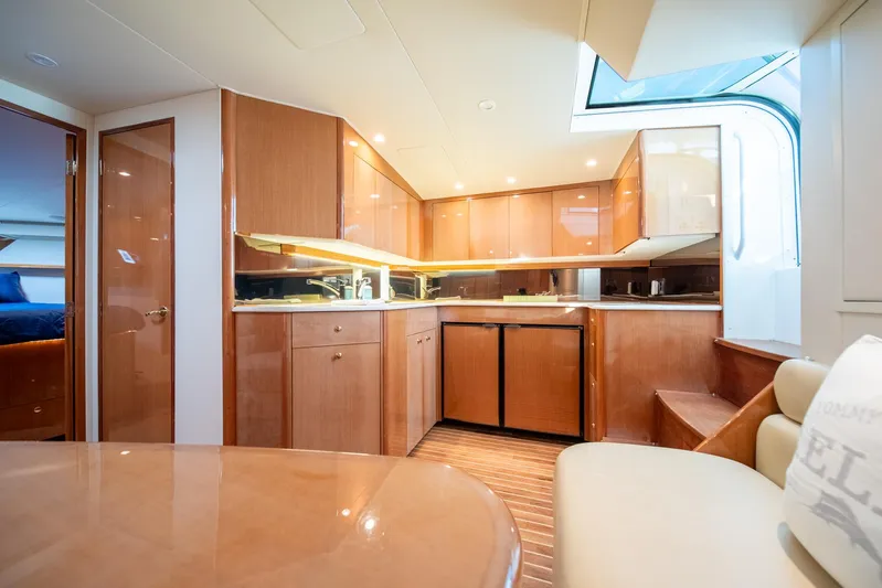 Urgent Sea Yacht Photos Pics Luxurious 2003 Viking 45 Express yacht interior with modern kitchen and seating area.