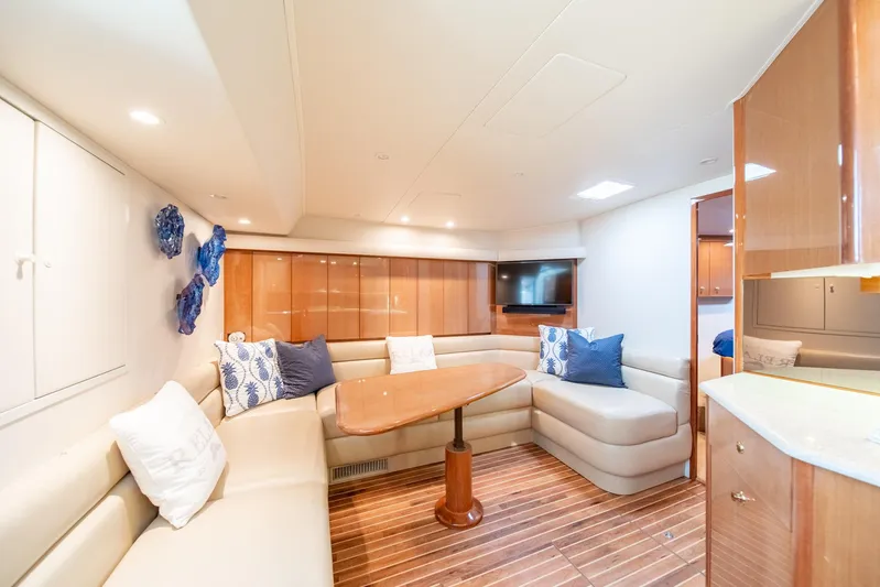 Urgent Sea Yacht Photos Pics Luxurious interior of 2003 Viking 45 Express yacht with elegant seating and wooden flooring.