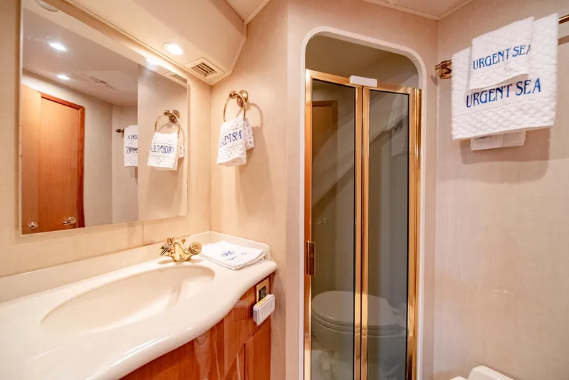 Urgent Sea Yacht Photos Pics Luxurious bathroom in 2003 Viking 45 Express yacht with elegant fixtures and shower.