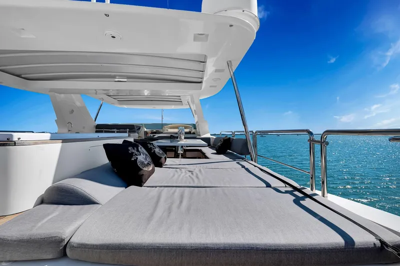 Babieca Yacht Photos Pics Luxurious 2005 Azimut 105 yacht deck with sun loungers and ocean view.