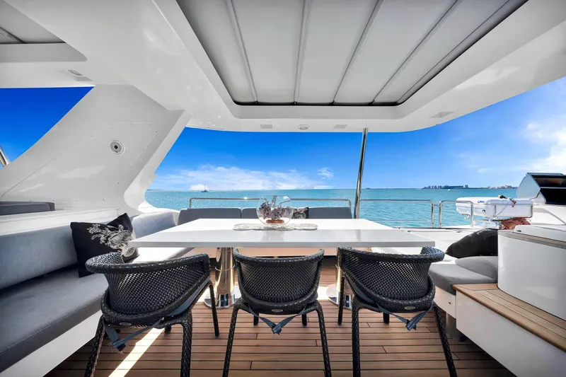 Babieca Yacht Photos Pics Luxurious 2005 Azimut 105 yacht deck with elegant seating and ocean view.