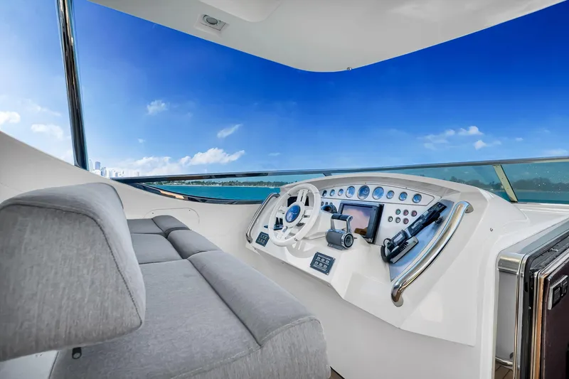 Babieca Yacht Photos Pics Luxurious 2005 Azimut 105 yacht helm with modern controls and panoramic ocean view.
