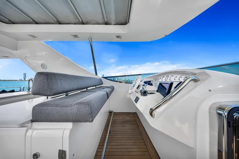 Babieca Yacht Photos Pics Luxurious 2005 Azimut 105 yacht helm with modern controls and ocean view.