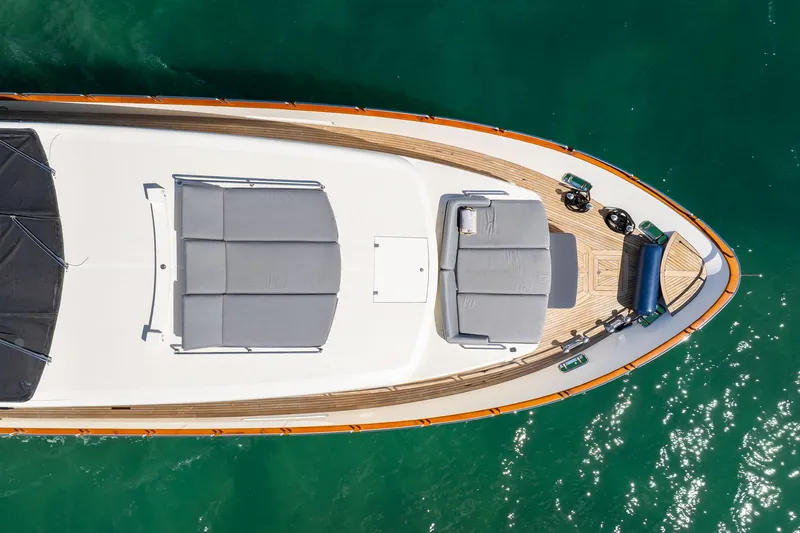 Babieca Yacht Photos Pics Aerial view of 2005 Azimut 105 yacht deck on turquoise water.