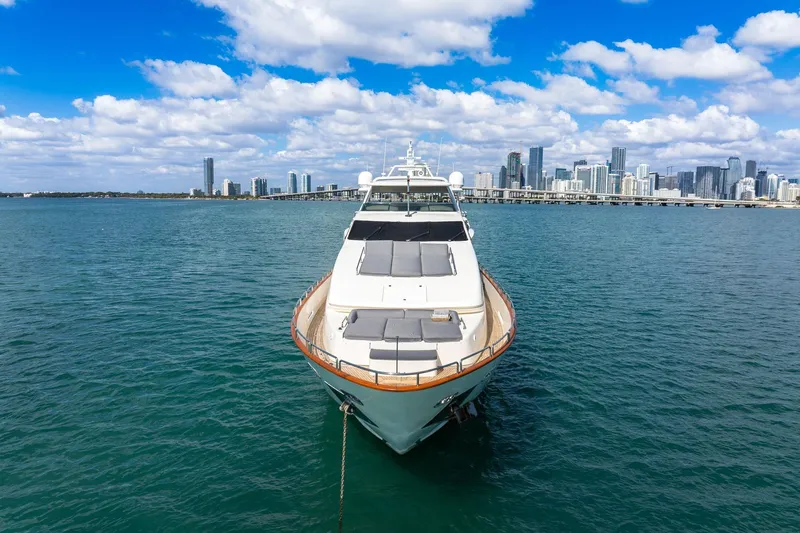 Babieca Yacht Photos Pics Luxury 2005 Azimut 105 yacht anchored with city skyline backdrop.