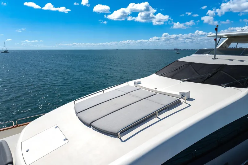 Babieca Yacht Photos Pics Luxurious 2005 Azimut 105 yacht deck with ocean view under blue sky.