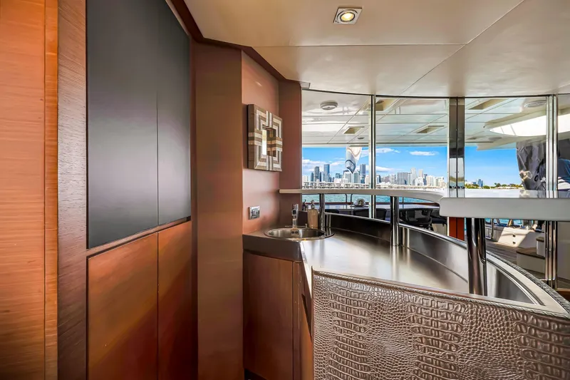 Babieca Yacht Photos Pics Luxurious interior of 2005 Azimut 105 yacht with city skyline view.