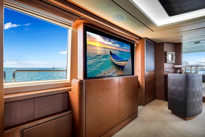 Babieca Yacht Photos Pics Luxurious interior of 2005 Azimut 105 yacht with ocean view and large TV screen.