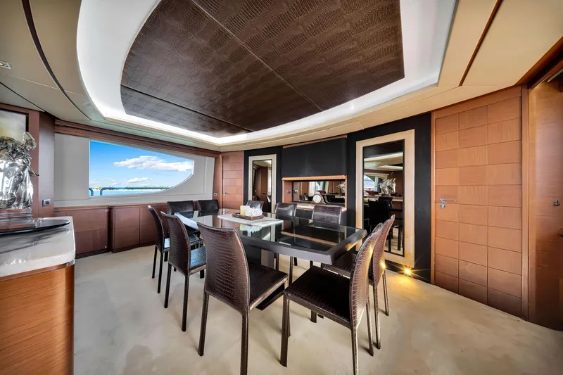 Babieca Yacht Photos Pics Luxurious dining area on 2005 Azimut 105 yacht with elegant furnishings and ocean view.