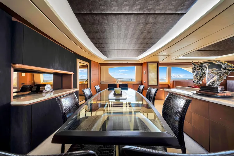 Babieca Yacht Photos Pics Luxurious interior of 2005 Azimut 105 yacht with elegant dining area and modern decor.