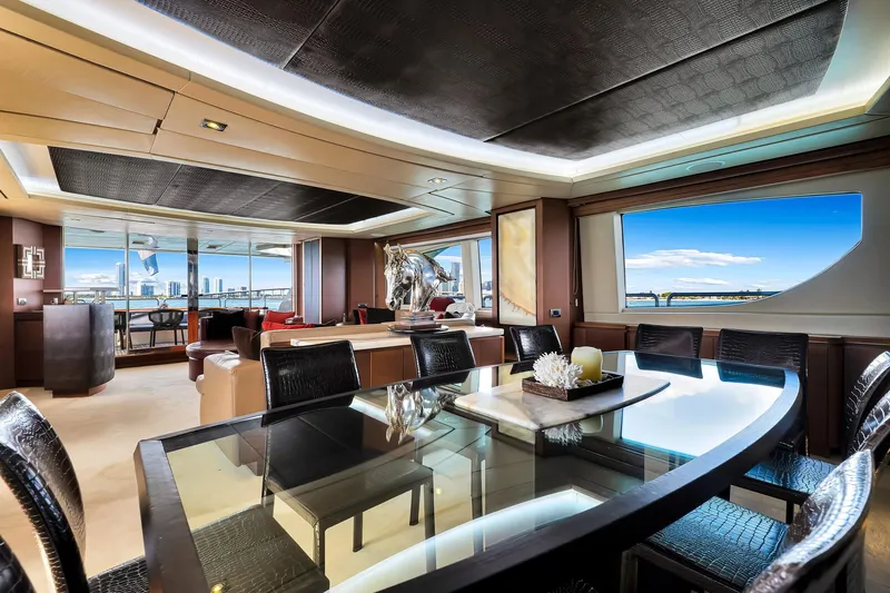 Babieca Yacht Photos Pics Luxurious interior of 2005 Azimut 105 yacht with elegant dining area and scenic ocean views.