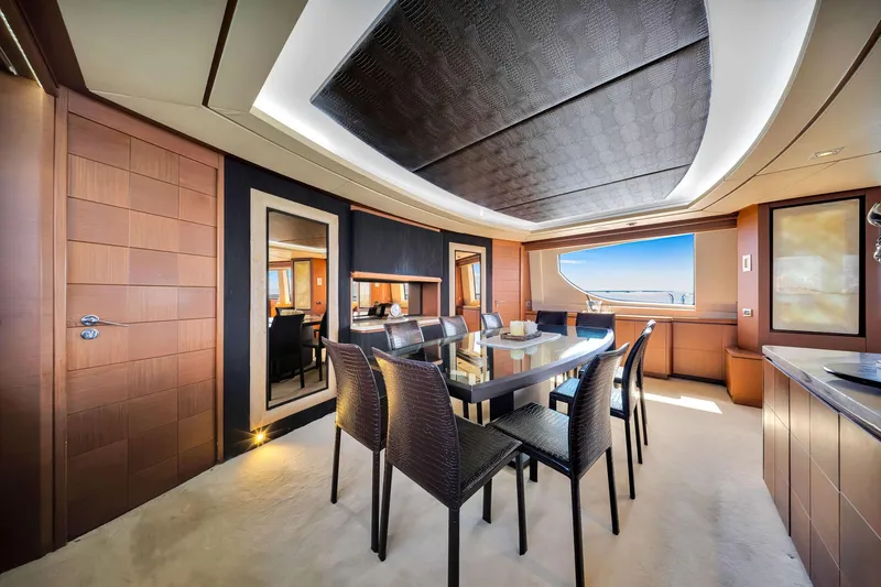 Babieca Yacht Photos Pics Luxurious dining area on 2005 Azimut 105 yacht with elegant furnishings and ocean view.