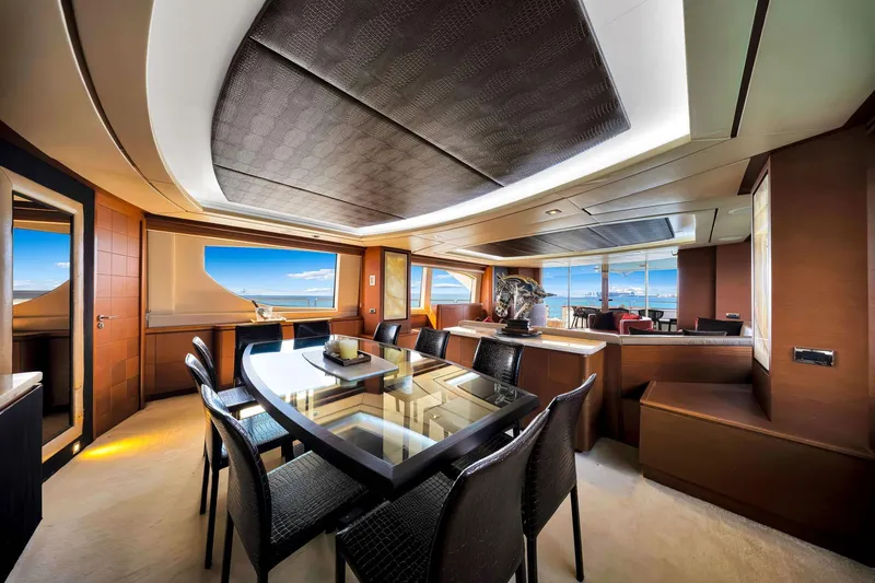 Babieca Yacht Photos Pics Luxurious interior of 2005 Azimut 105 yacht with elegant dining area and ocean view.