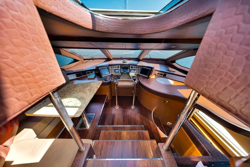 Babieca Yacht Photos Pics Luxurious interior of 2005 Azimut 105 yacht with modern navigation equipment and elegant design.