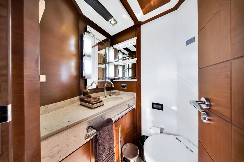 Babieca Yacht Photos Pics Luxurious bathroom interior of 2005 Azimut 105 yacht with modern fixtures and wood accents.