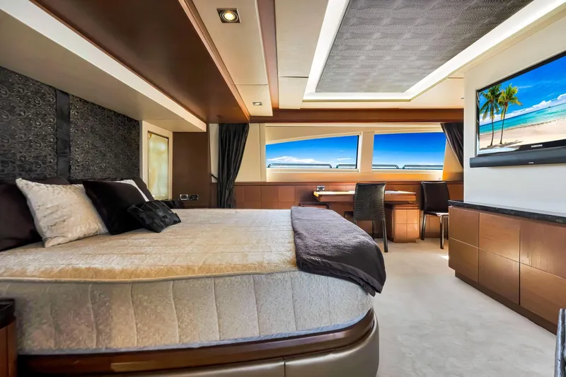 Babieca Yacht Photos Pics Luxurious bedroom interior of 2005 Azimut 105 yacht with ocean view and modern decor.