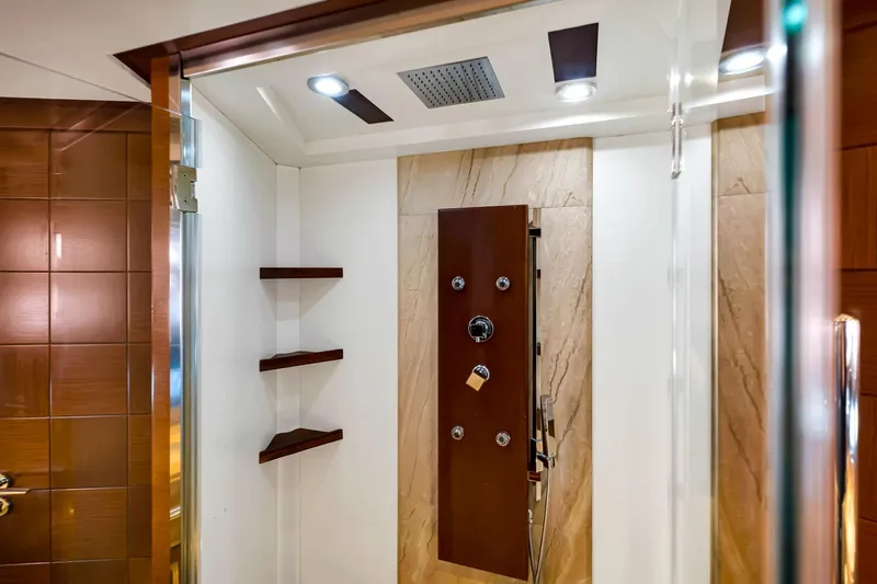 Babieca Yacht Photos Pics Luxurious shower interior on a 2005 Azimut 105 yacht, featuring modern fixtures and elegant design.